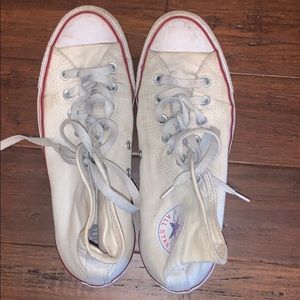 Worn white high top converse